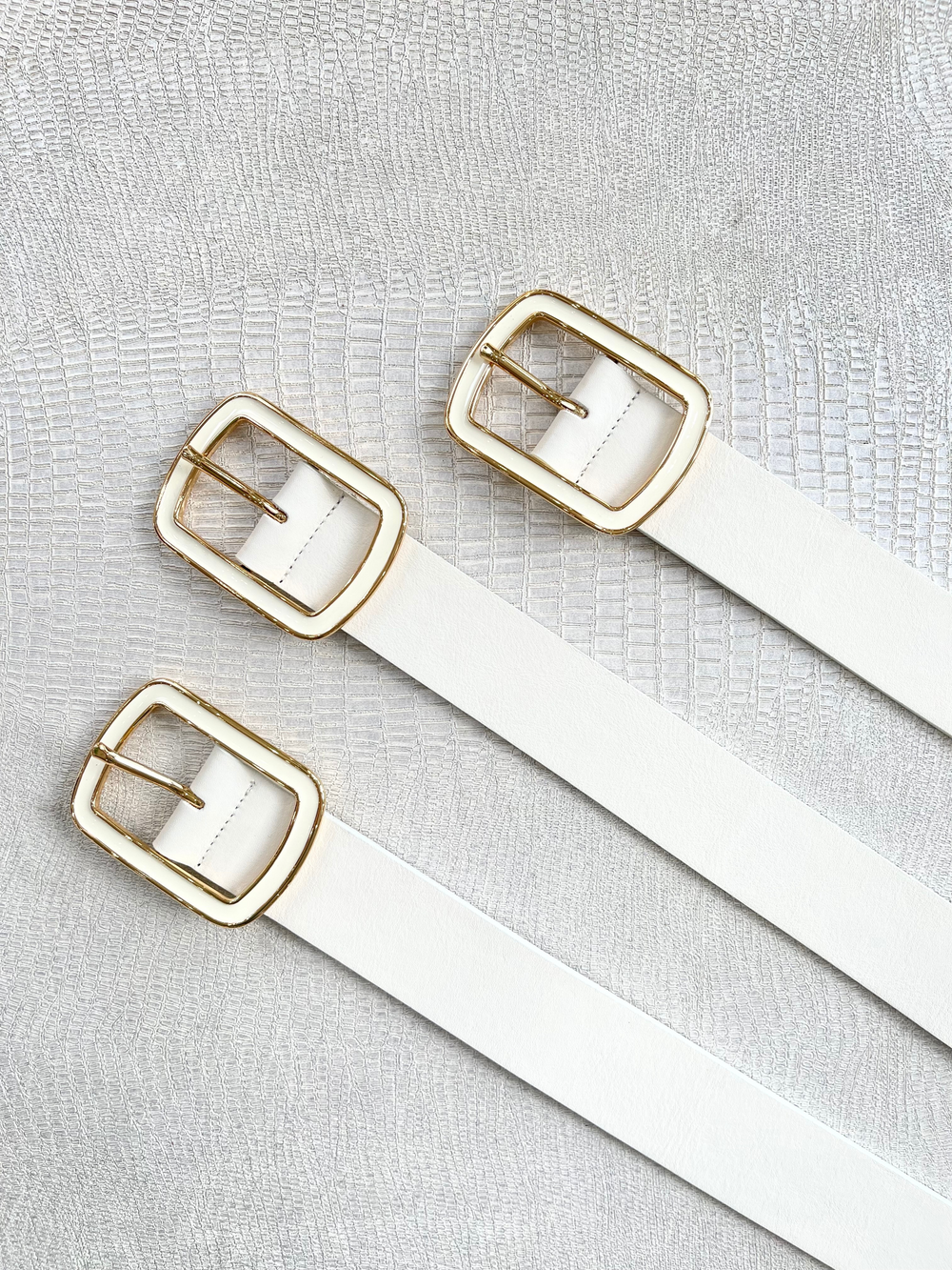 White belt with gold buckle